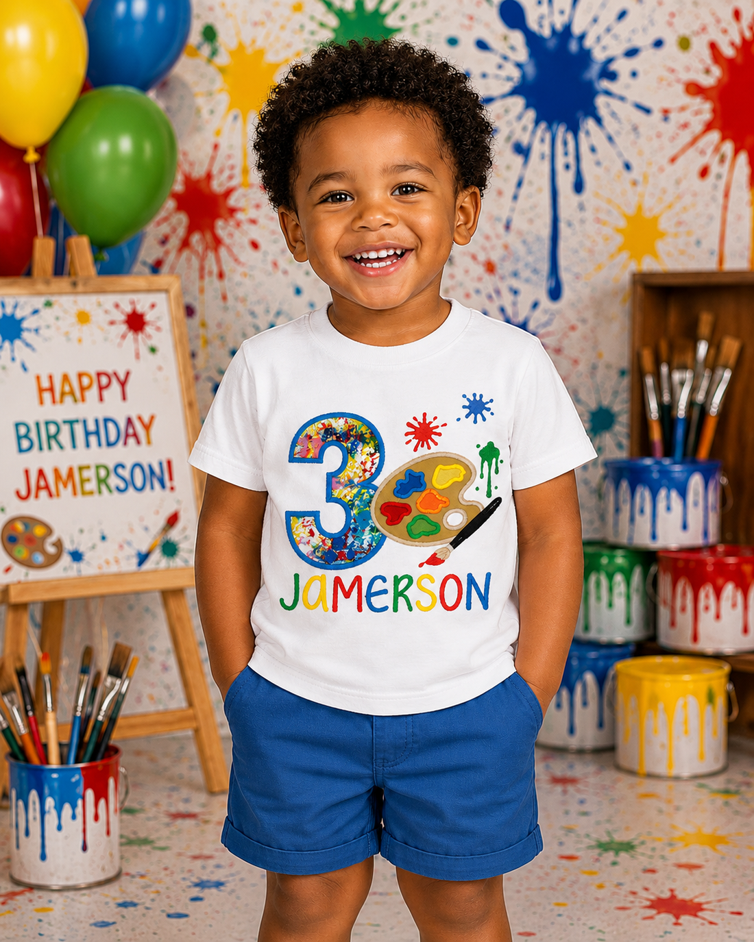 Personalized embroidered boy's paint party birthday shirt featuring colorful birthday number 3, artist paint palette, paintbrush, and custom name Jamerson on a white 100% cotton shirt.