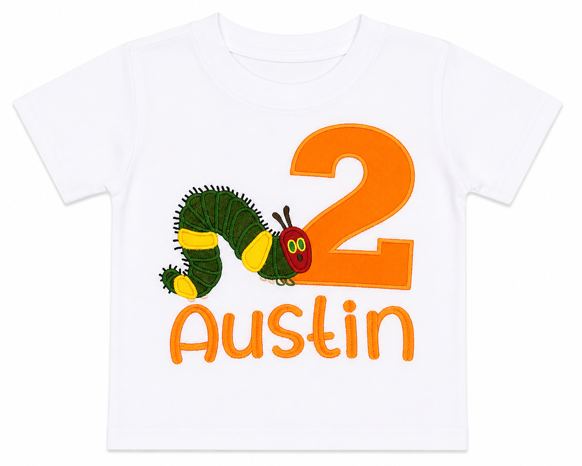 A white short-sleeve kids' t-shirt featuring a colorful graphic of the Good Guys caterpillar next to a large orange number 2, with the name 'Austin' printed below in orange.