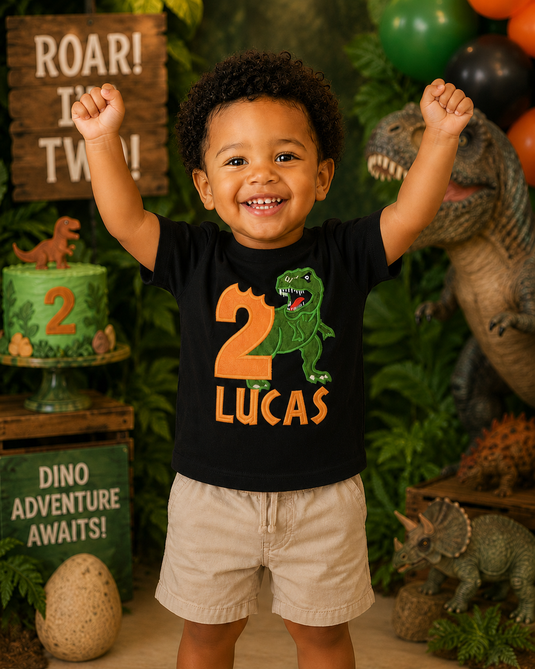 Personalized embroidered dinosaur birthday shirt for boys featuring a green T-Rex, orange number 2, and custom embroidered name Lucas on a black 100% cotton shirt at a dinosaur-themed birthday party. | RoJo Custom Designs