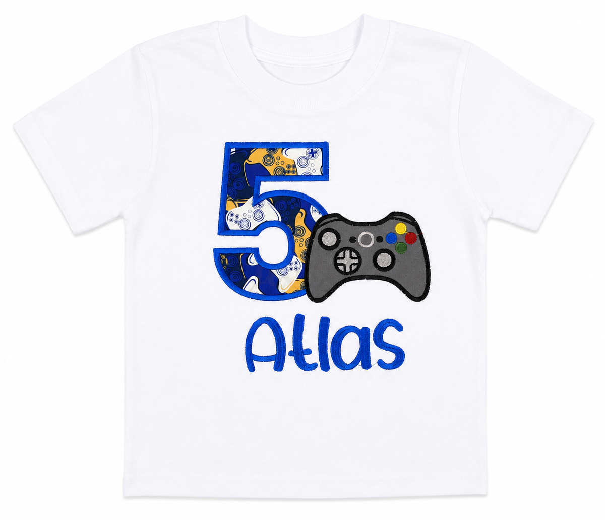 Lay-flat view of a personalized embroidered gaming birthday shirt featuring a blue number 5, video game controller, and custom embroidered name Atlas on a white 100% cotton shirt. | RoJo Custom Designs