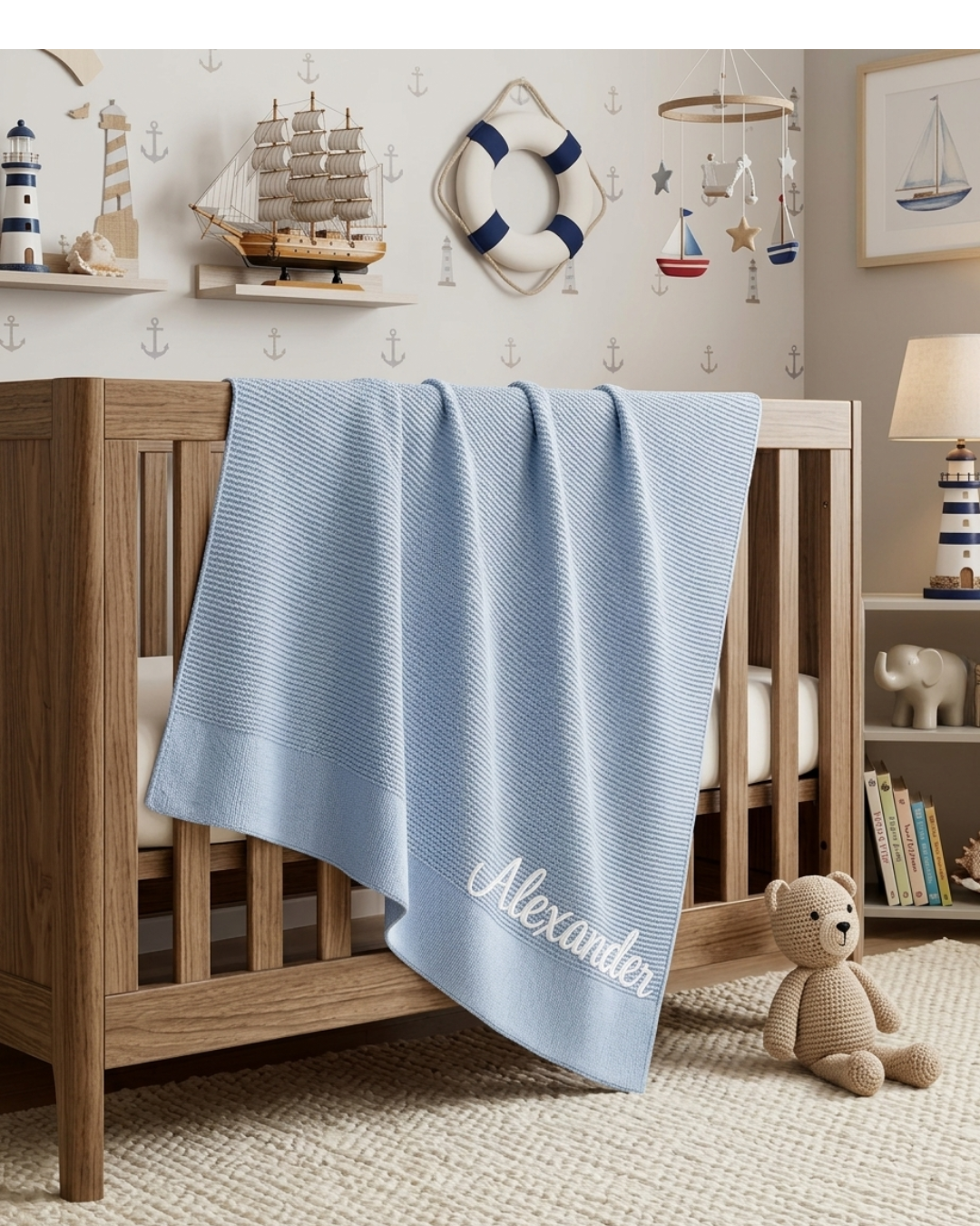 Personalized knit baby blanket with embroidered child name in soft knit fabric available in White, Pink, Sage Green, and Light Blue