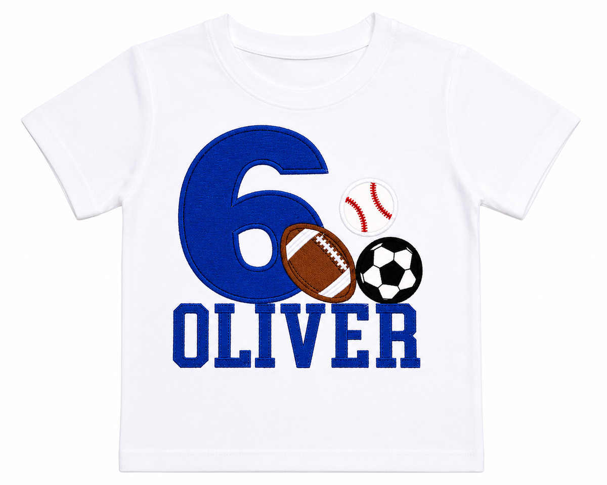 Lay-flat view of a personalized embroidered all sports birthday shirt featuring a blue number 6 with baseball, football, soccer ball, and custom name Oliver on a white 100% cotton shirt. | RoJo Custom Designs