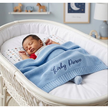 Personalized knit baby blanket with embroidered child name in soft knit fabric available in White, Pink, Sage Green, and Light Blue