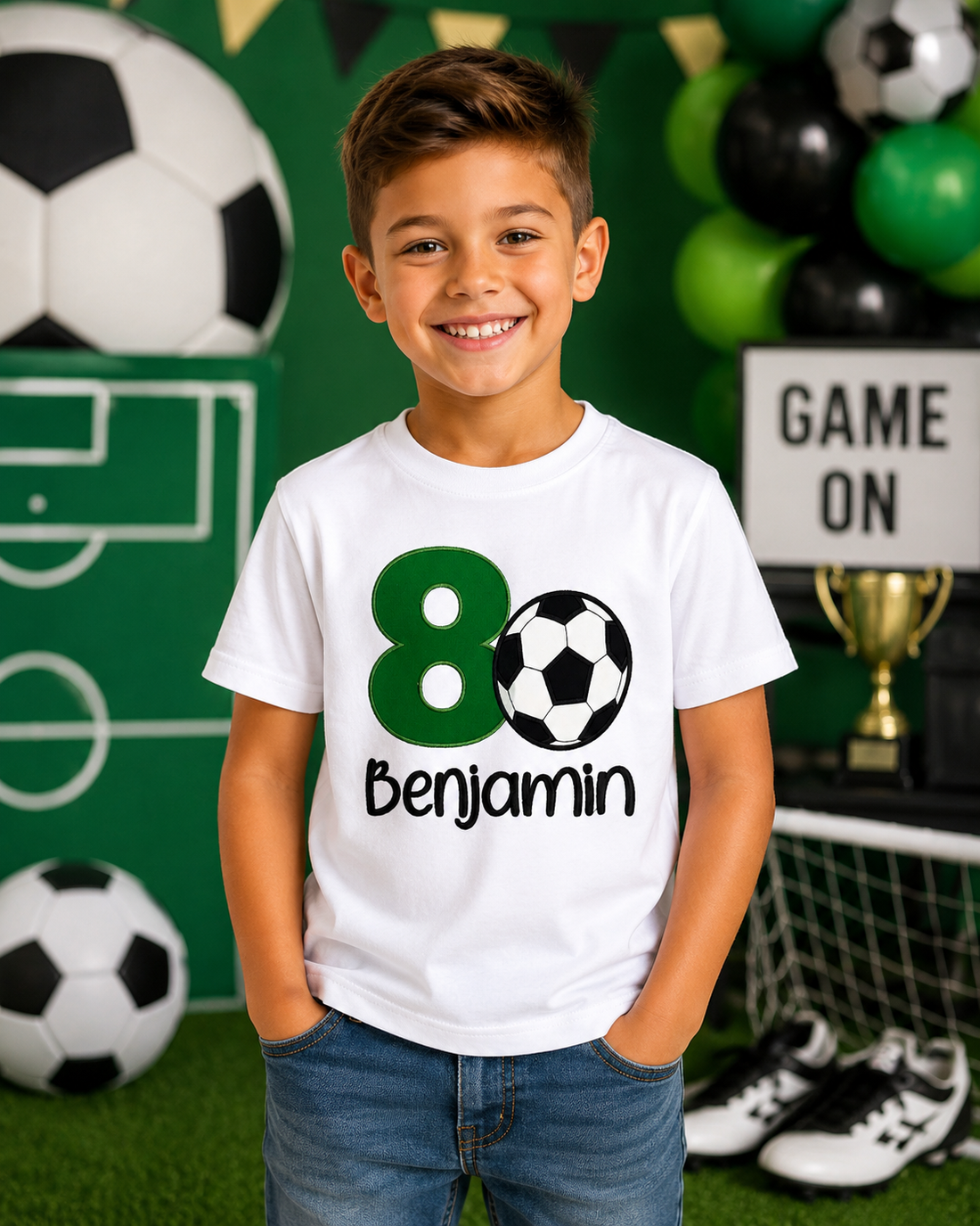 Boy wearing a personalized embroidered soccer birthday shirt featuring a green number 8, soccer ball appliqué, and custom name Benjamin at a soccer-themed birthday party on a white 100% cotton shirt. | RoJo Custom Designs