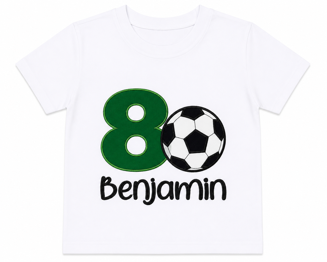 Boy wearing a personalized embroidered soccer birthday shirt featuring a green number 8, soccer ball appliqué, and custom name Benjamin at a soccer-themed birthday party on a white 100% cotton shirt. | RoJo Custom Designs