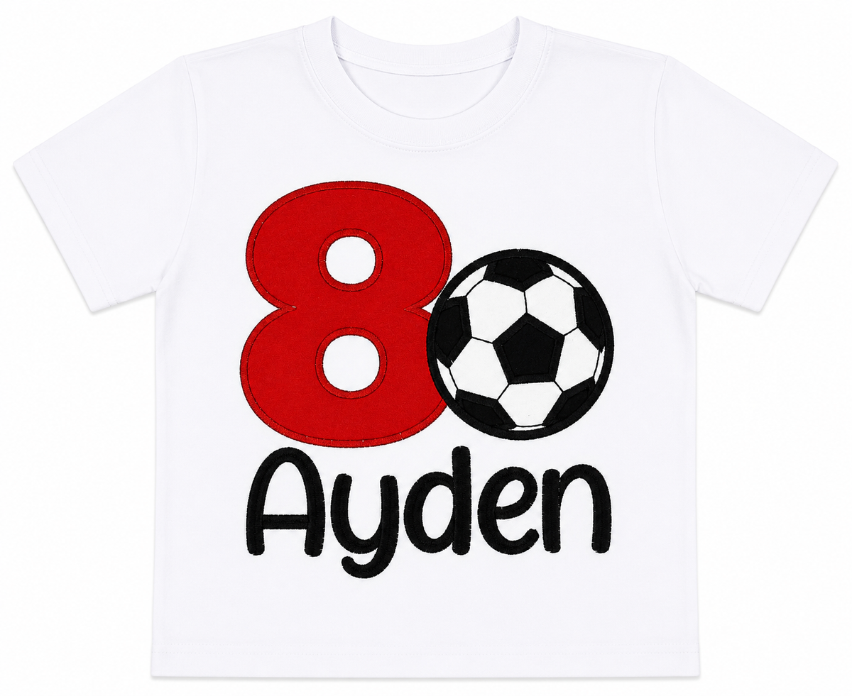 Lay-flat personalized embroidered soccer birthday shirt featuring a red number 8, soccer ball appliqué, and custom embroidered name Ayden on a white 100% cotton shirt. | RoJo Custom Designs